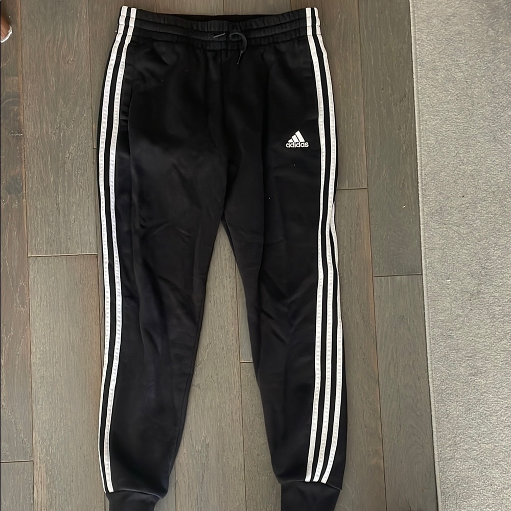Adidas Black Sweatpants with Iconic Stripes